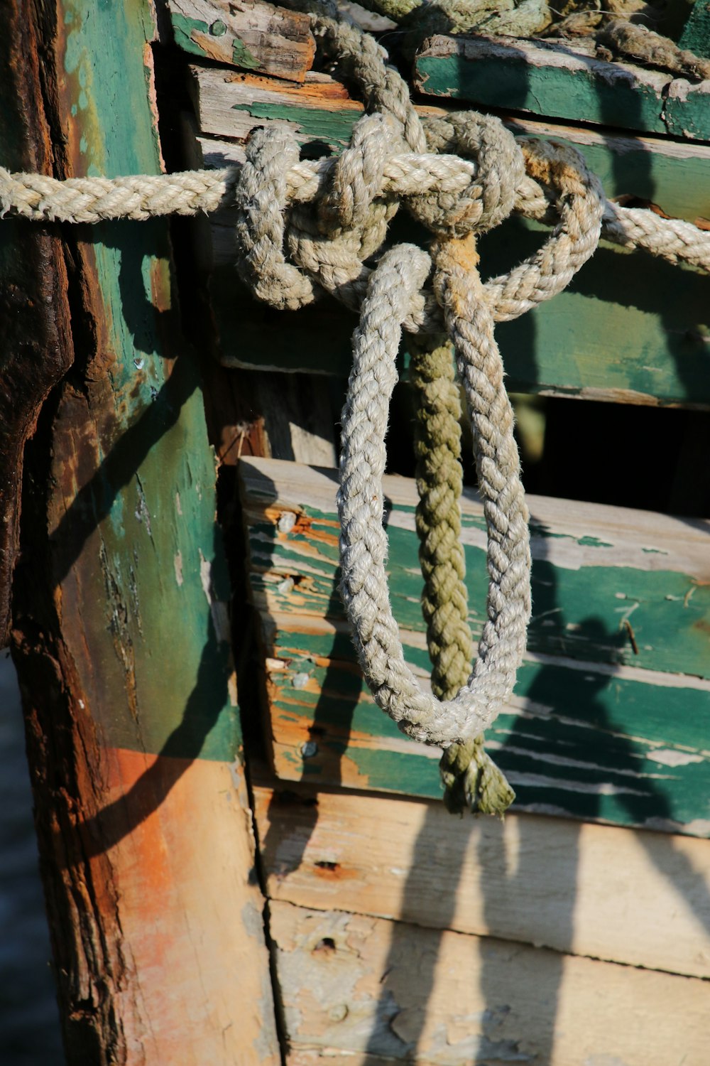 white rope on brown wooden plank