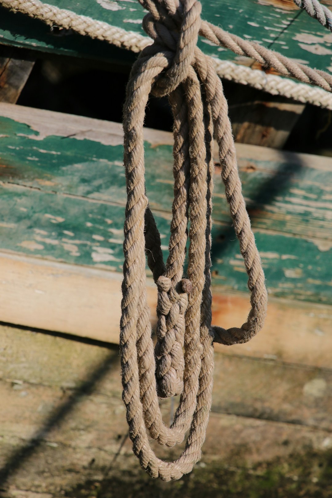 brown rope on green wooden table