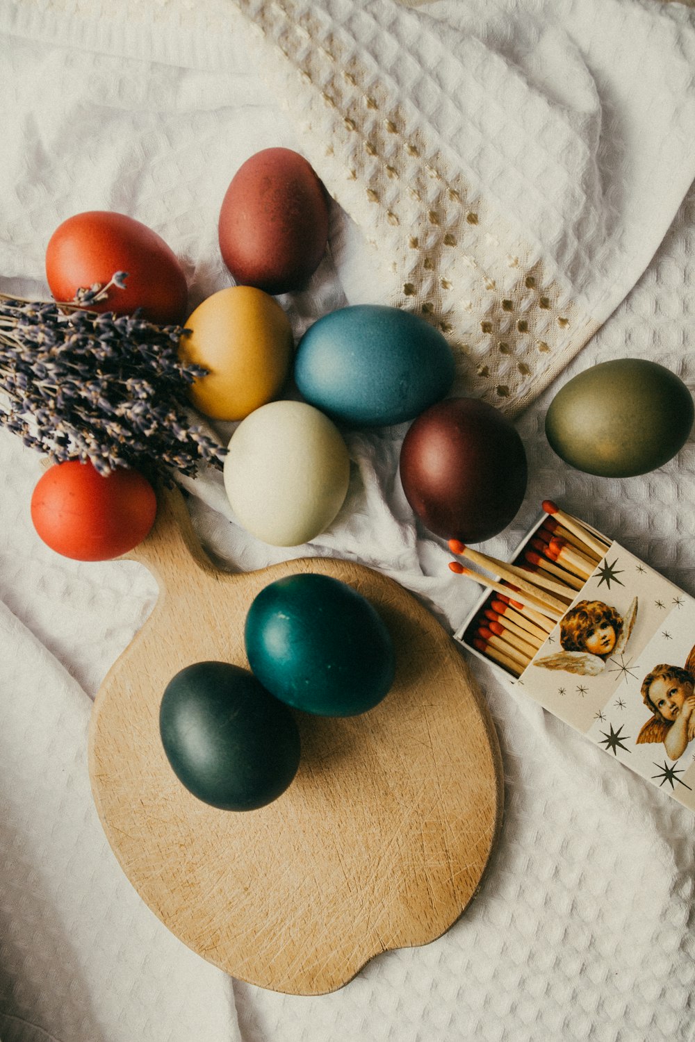 blue and orange egg on brown wooden round table