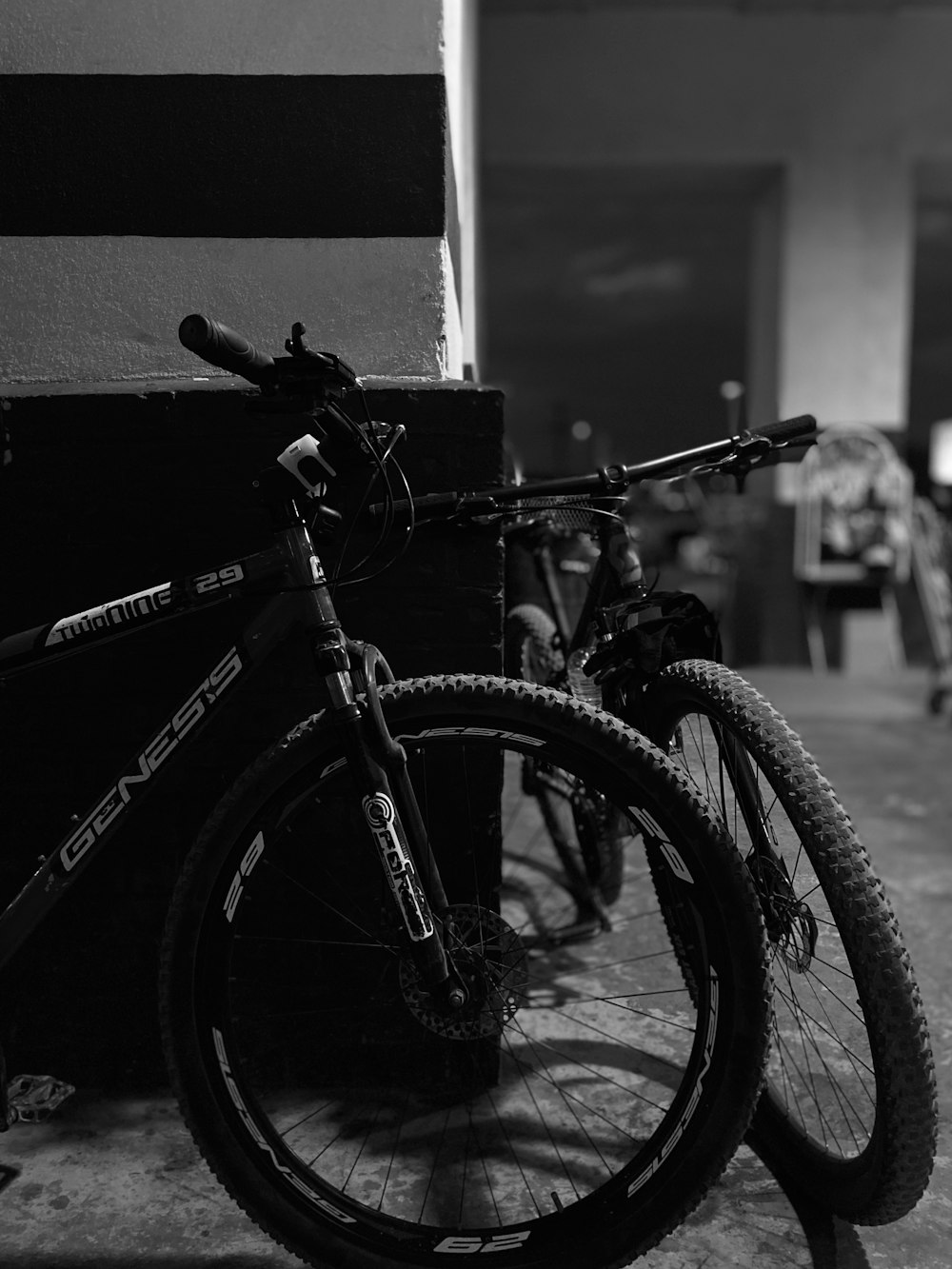 black mountain bike in grayscale photography