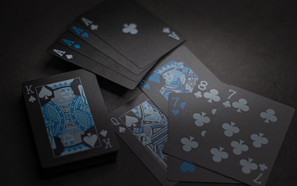 Deep blue background with translucent dark cards featuring orange numbers and turquoise details.
