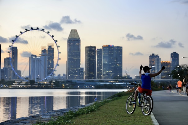 A close-up of a cyclist riding through a scenic urban landscape, highlighting the joy of biking.