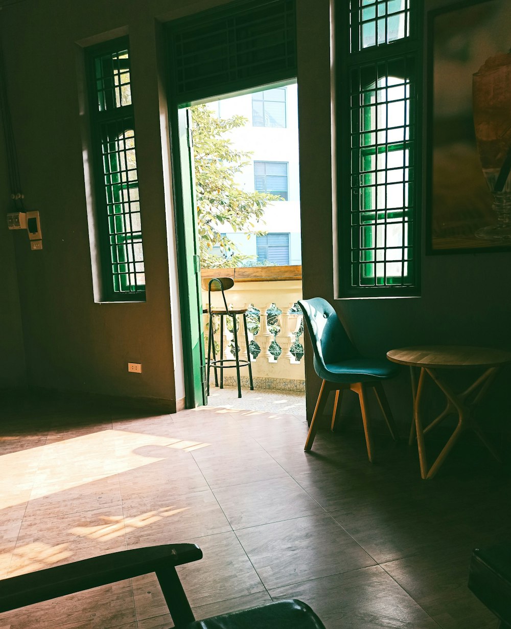 blue and brown wooden chair near brown wooden door