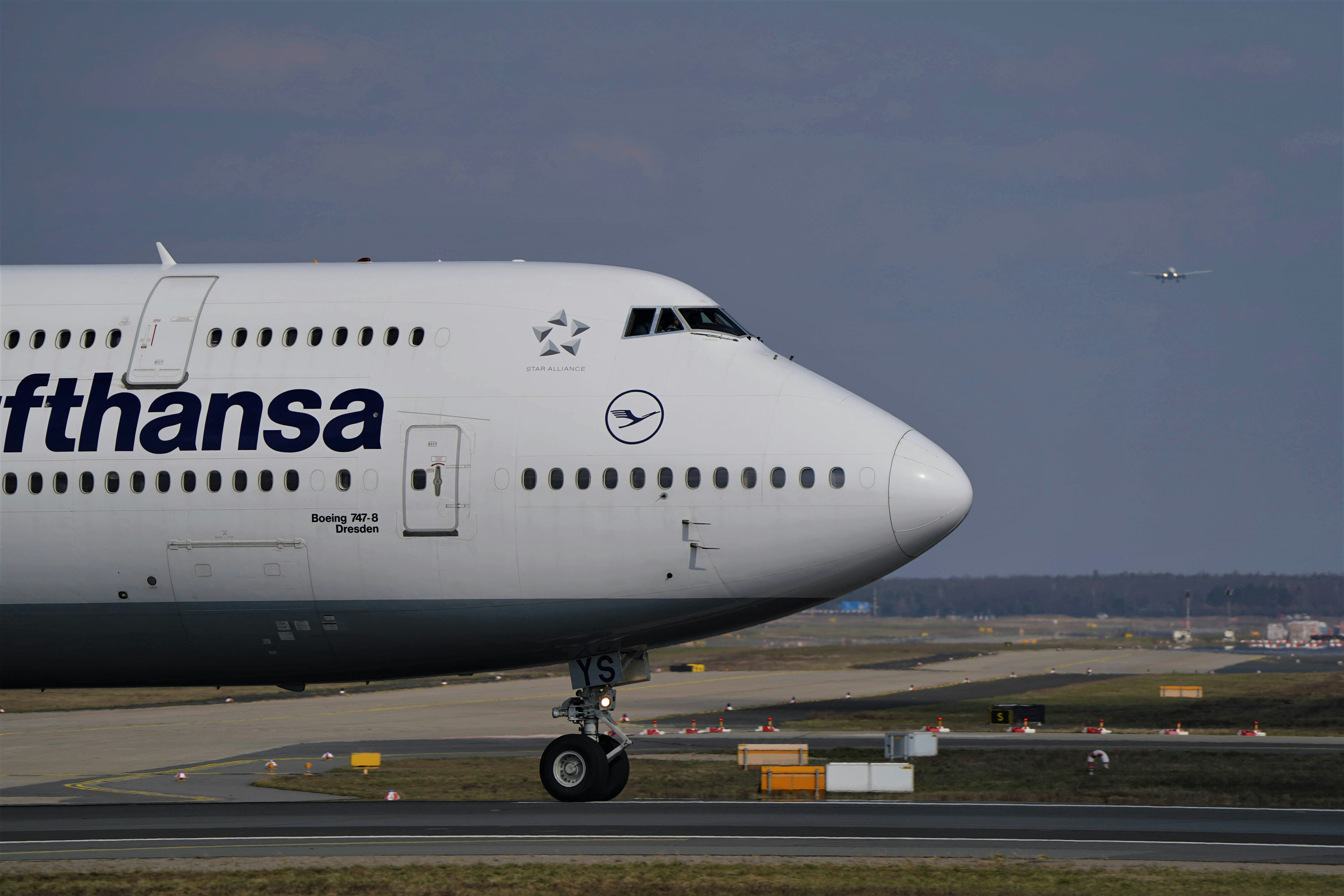 white passenger plane on airport during daytime, Lufthansa Boeing 747 during takeoff in Frankfurt!