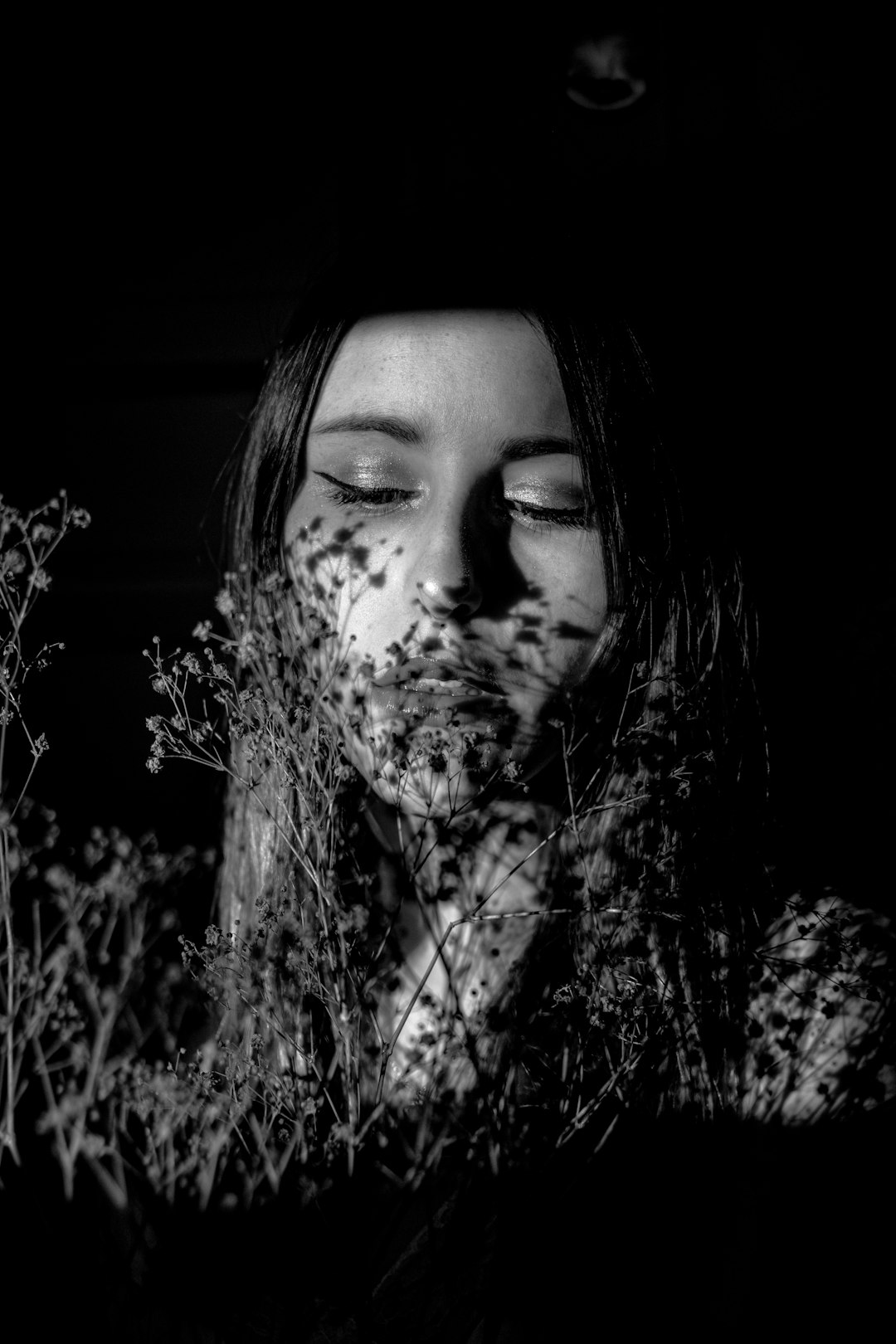 grayscale photo of woman with black and white background