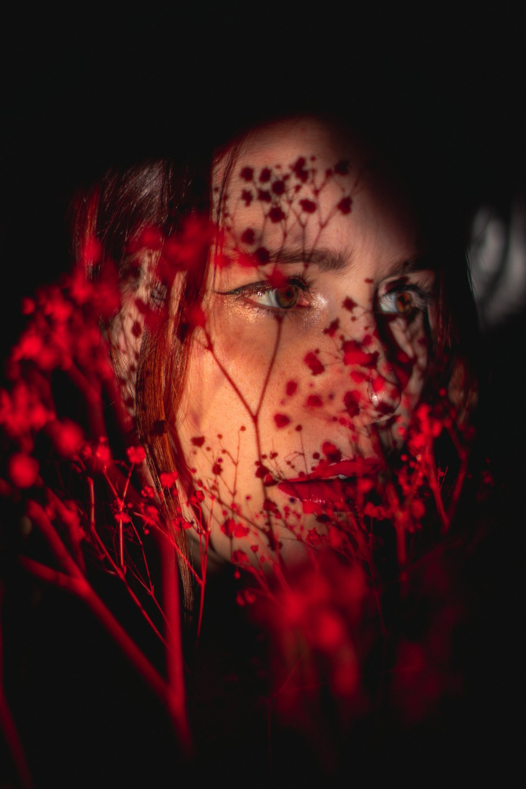 woman with red and black face paint