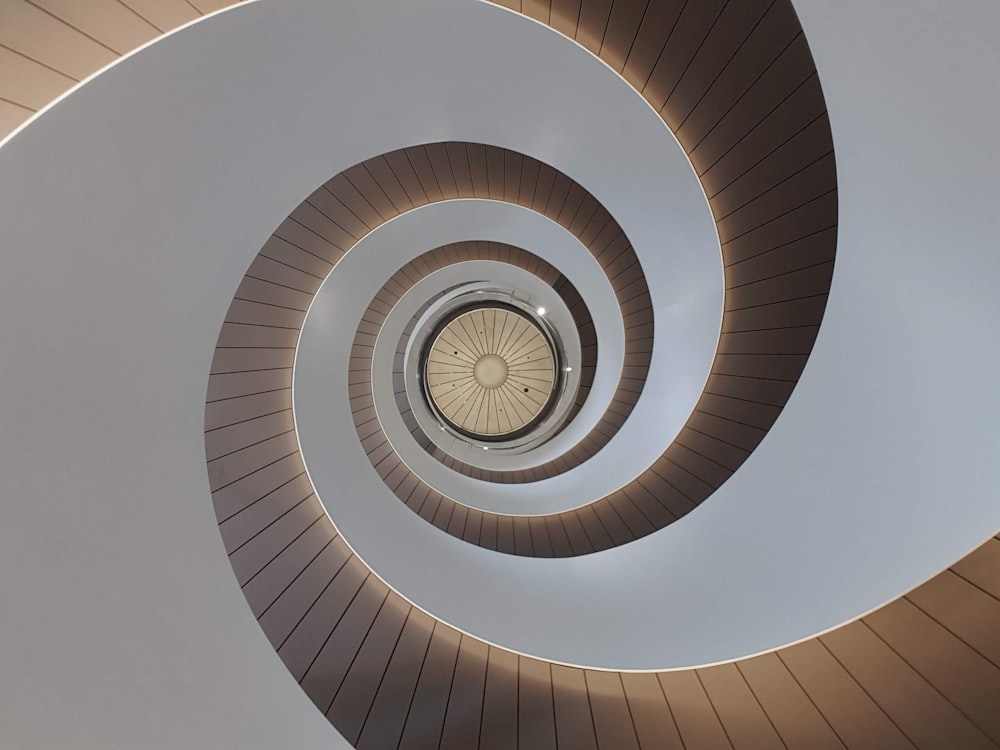 white spiral stairs with white ceiling