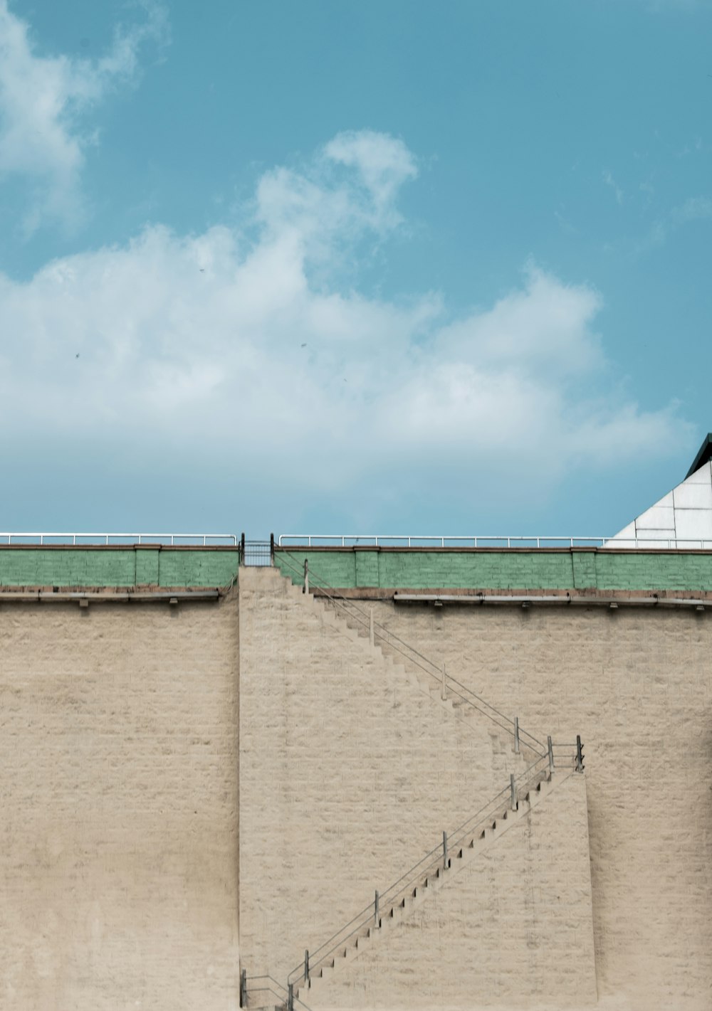 brown concrete wall under blue sky during daytime