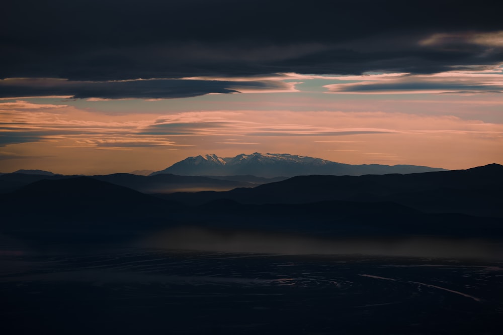 silhouette of mountains during sunset