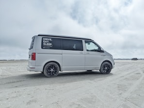 Mobile service van parked by a beachside home on Saint Simons Island.