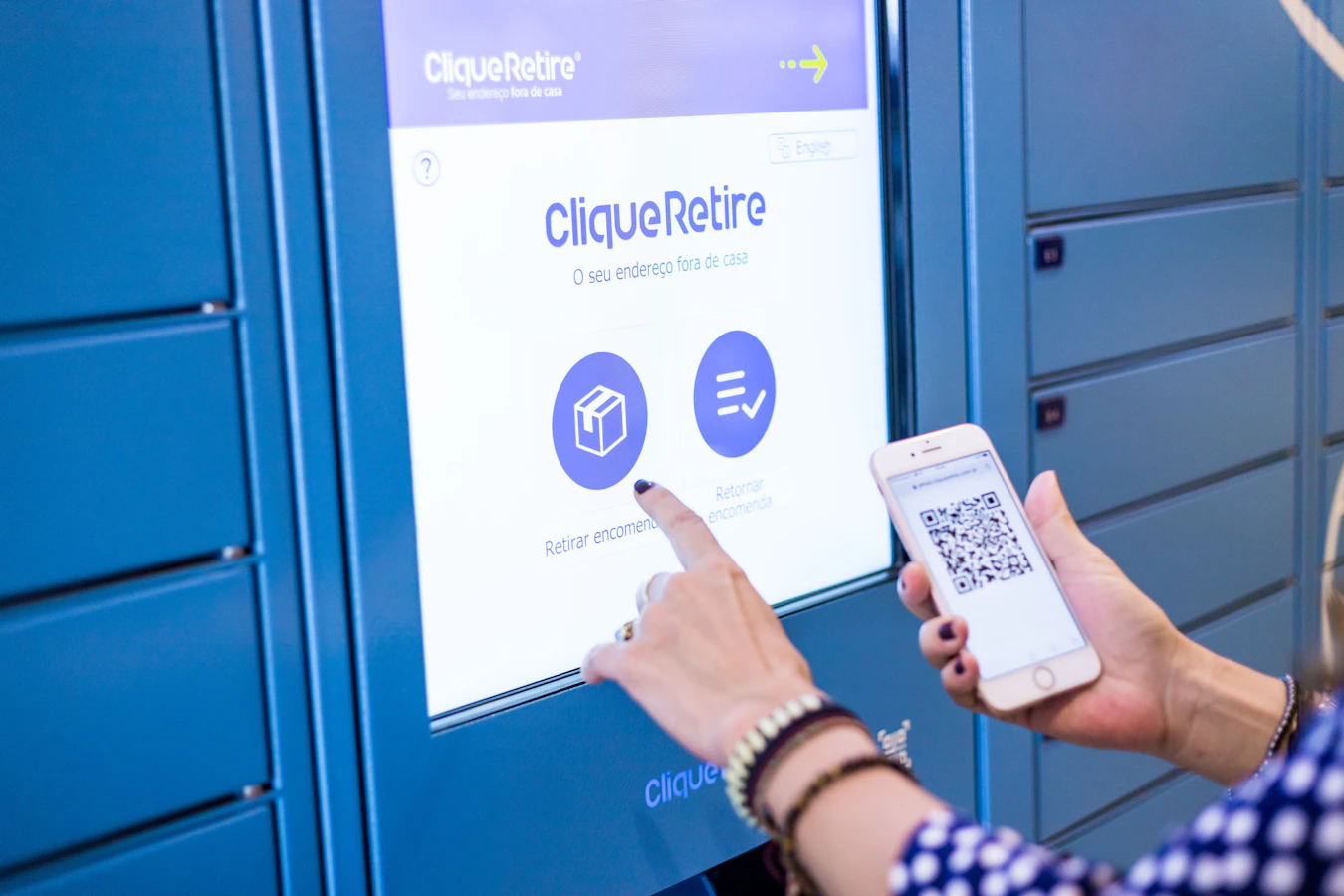 Delivery agent handing a package for locker deposit