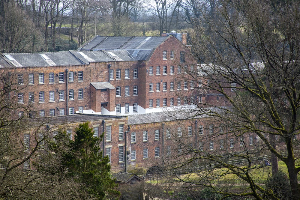 brown concrete building surrounded by trees during daytime