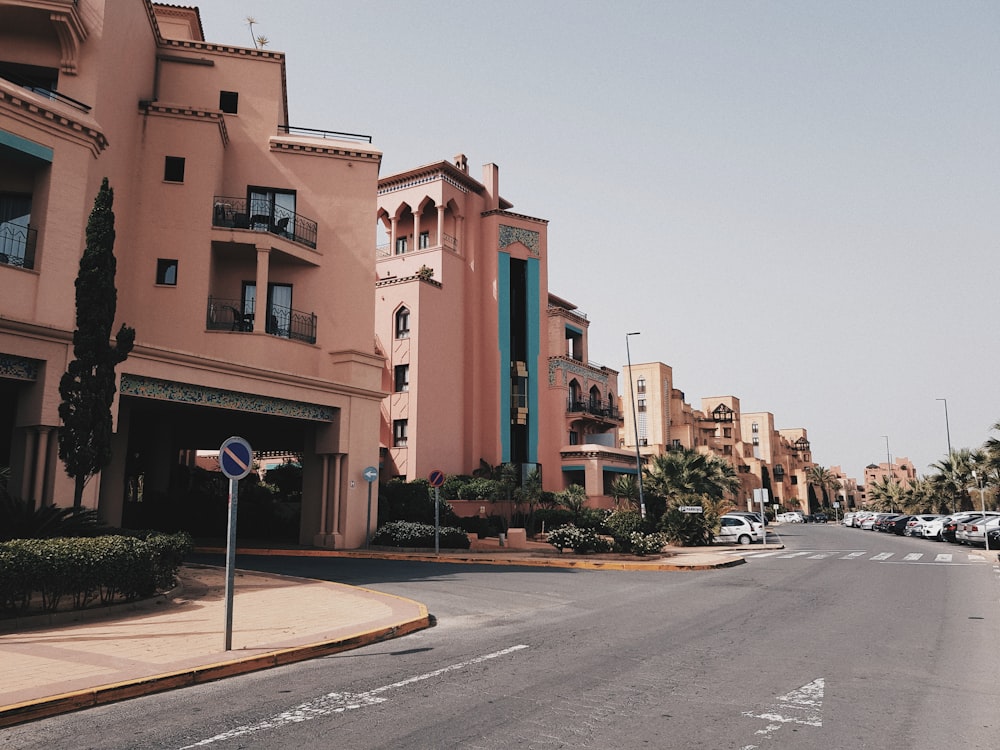 brown concrete building beside road during daytime