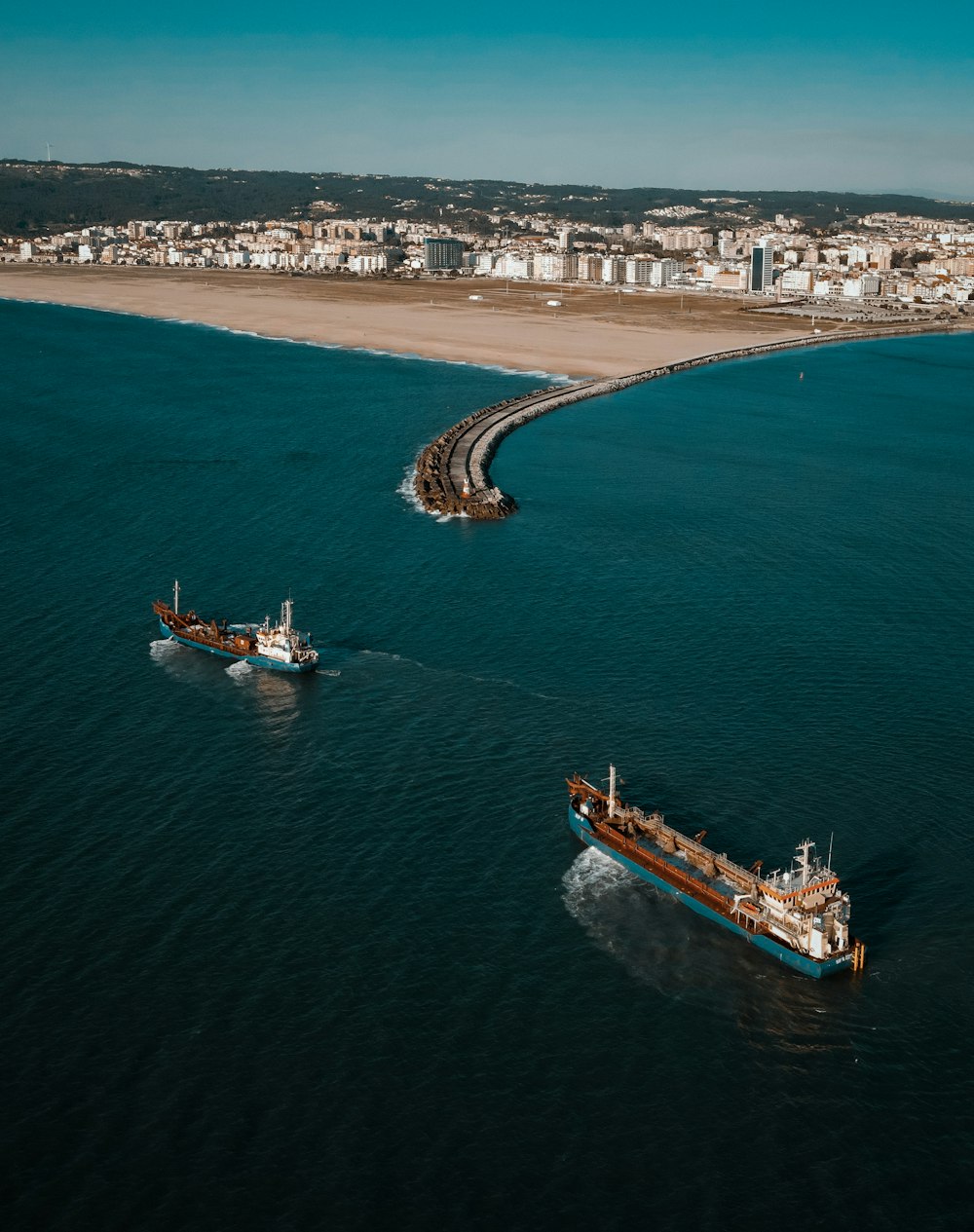 white and brown boat on sea during daytime