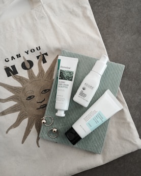 A vibrant shopping bag filled with stylish clothing and beauty products on a clean background