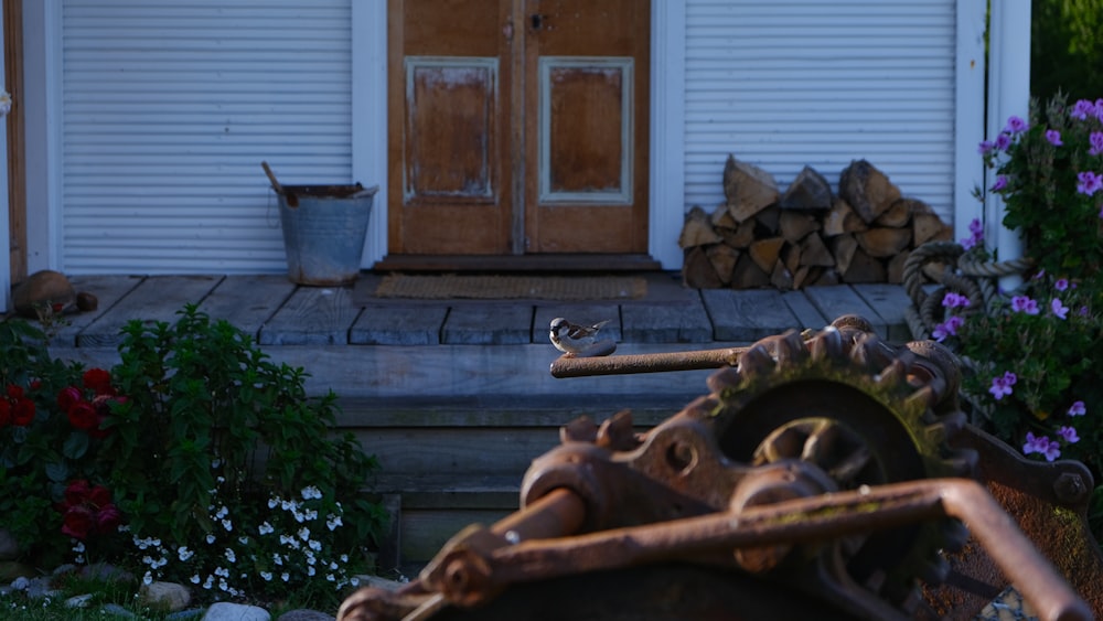 brown metal wheel near brown wooden door