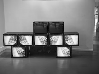 High-definition TVs arranged for viewing.