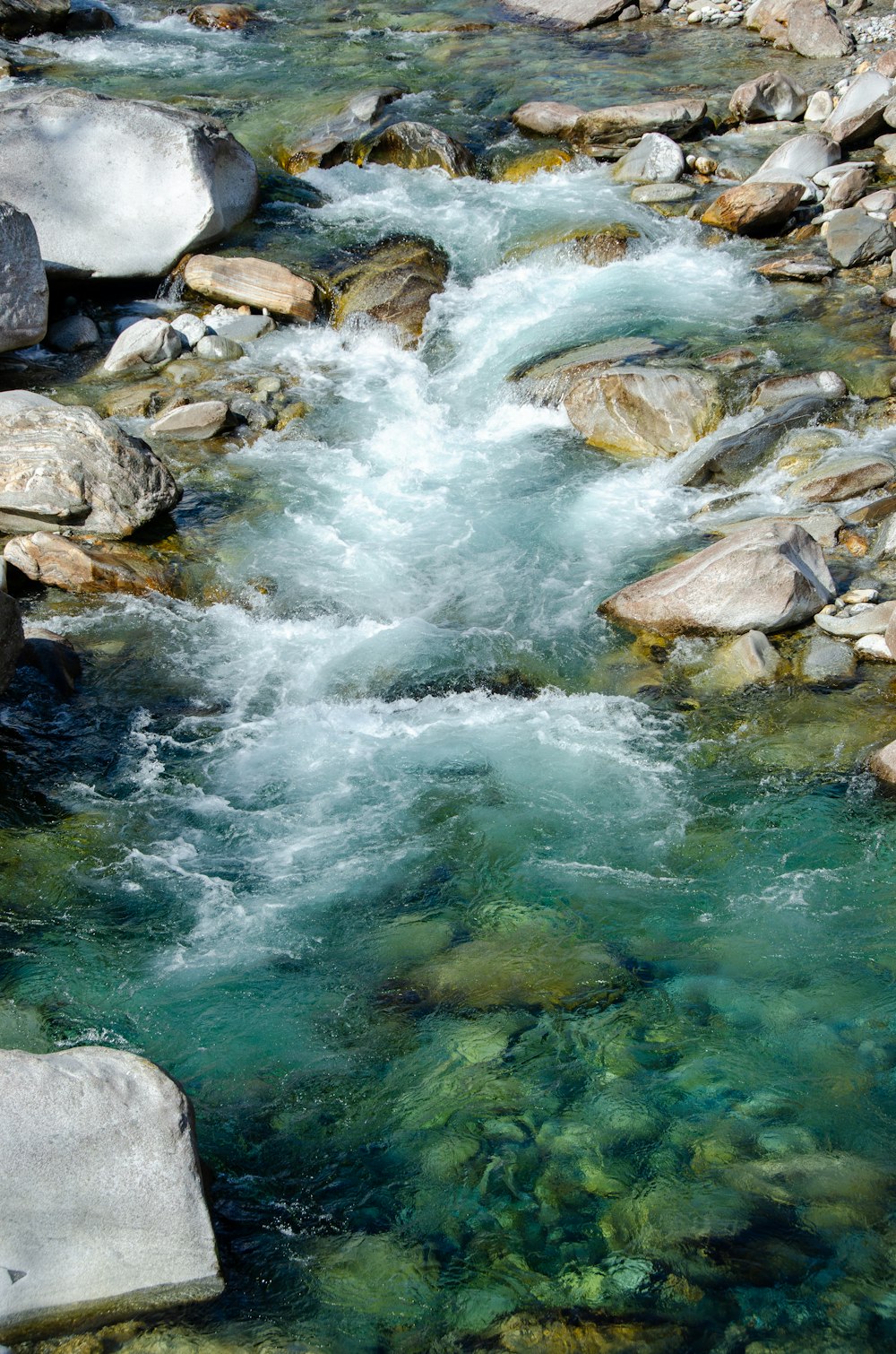 gray rocks on river during daytime