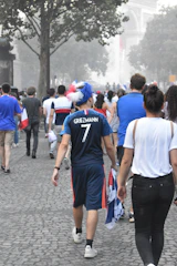Marchers walking together on a clear path from Place de la République to Place du Trocadéro.