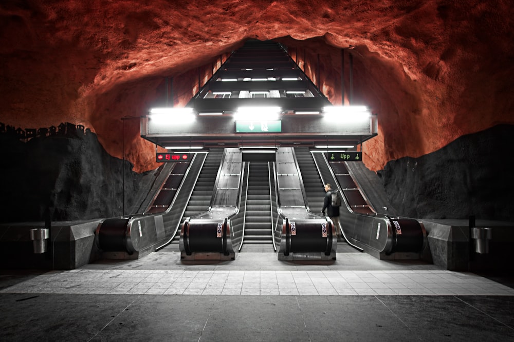 black escalator in a tunnel