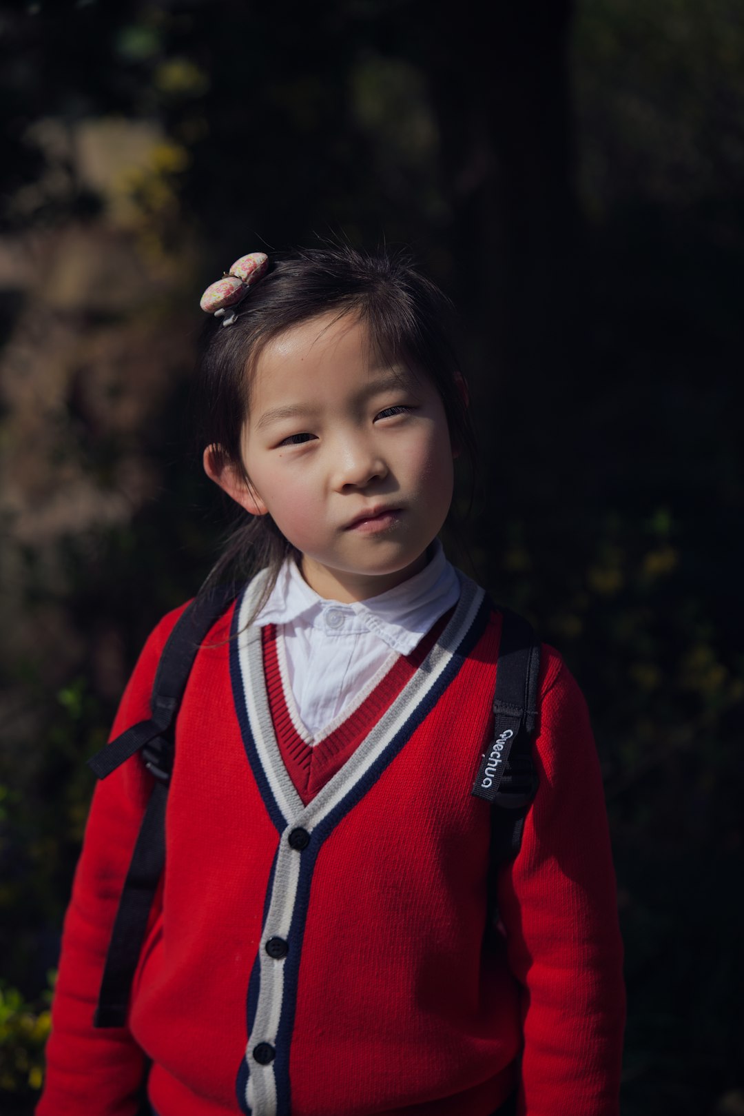 girl in red and white zip up jacket