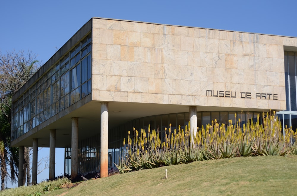 white concrete building near green grass field during daytime