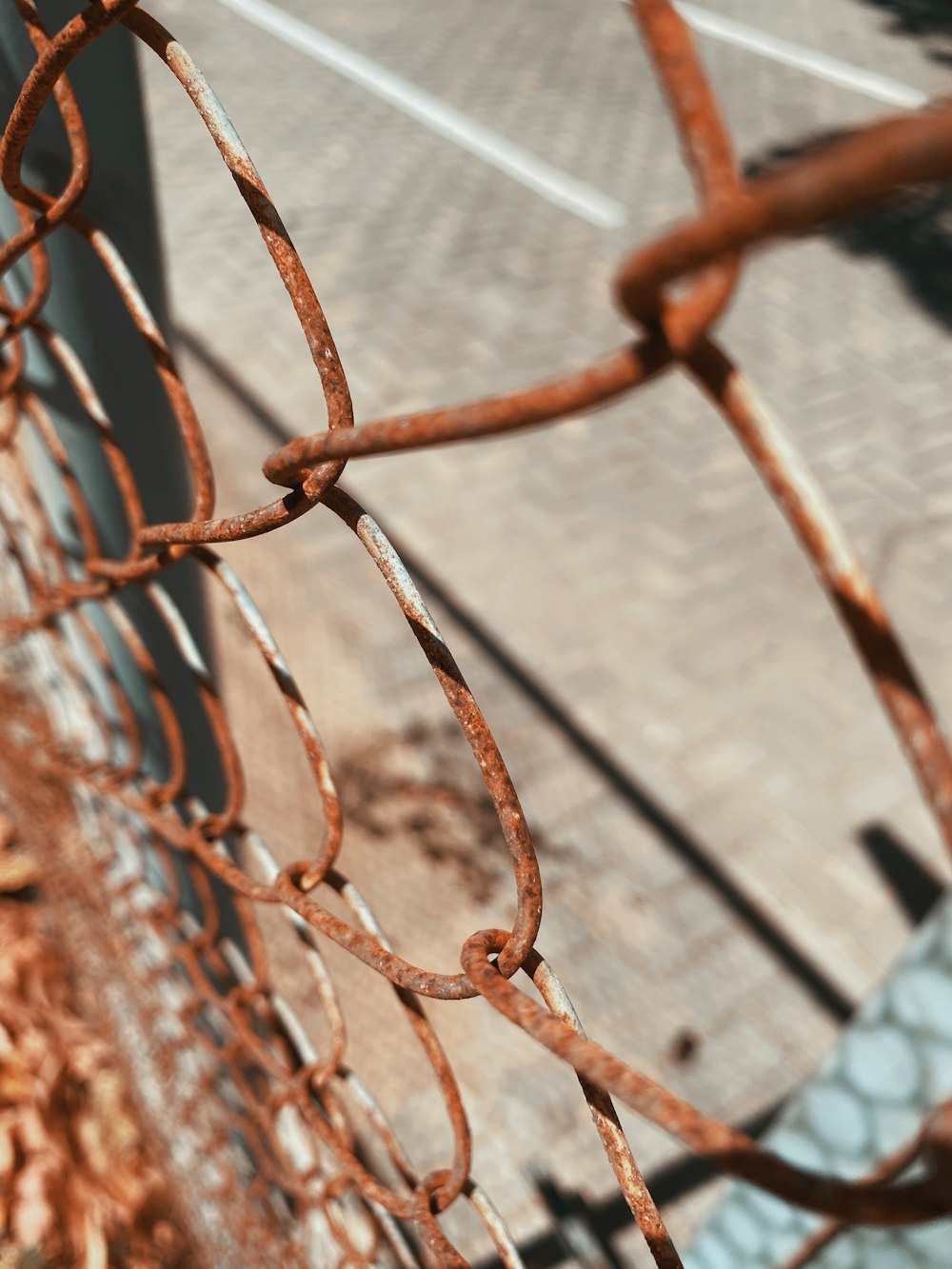 grey metal fence with chain link fence