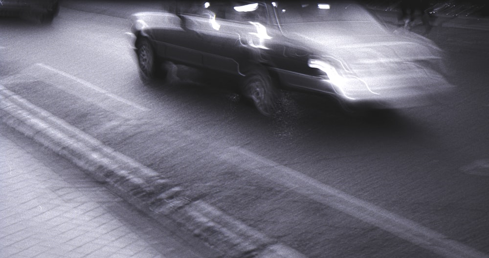 black car on road during night time