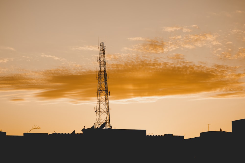 silhouette of building during sunset