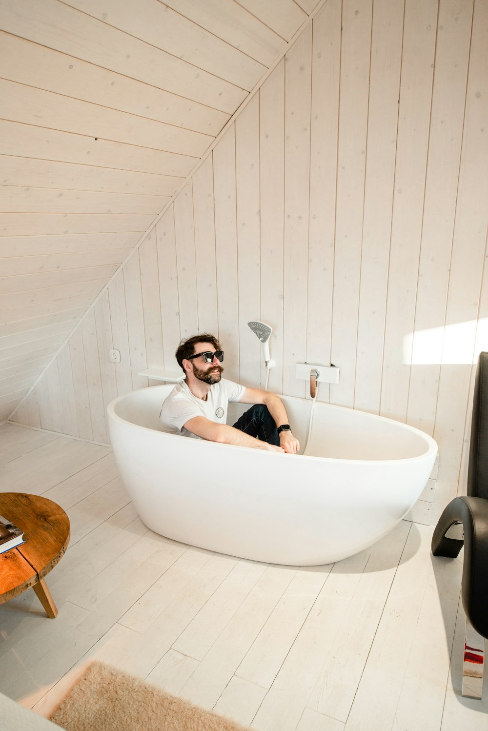 man in white bathtub with water