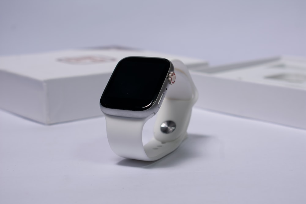 white and black apple watch