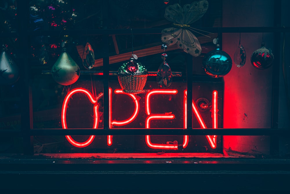 red and white open neon signage