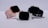 Three smartwatches are displayed on a light background. They feature different colored bands: pink, white, and black. The watches have large, rectangular touchscreens, and they are positioned to show off their sleek and modern design.