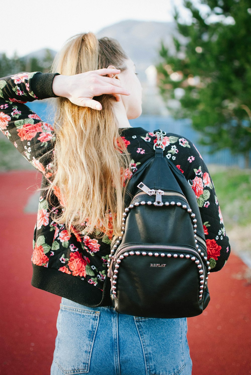 woman in black red and white floral long sleeve shirt