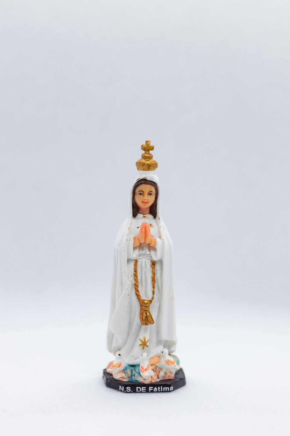 woman in white dress figurine