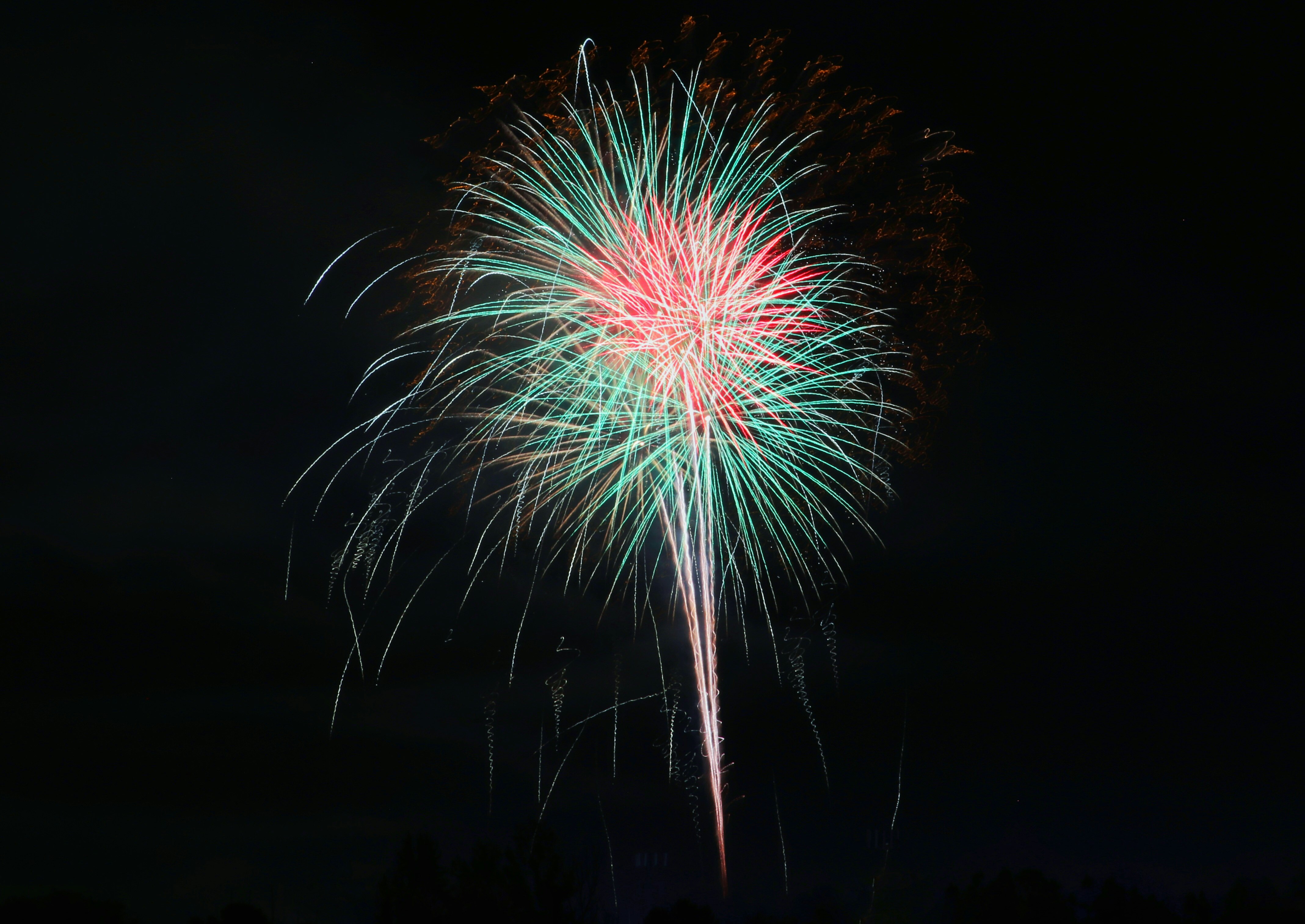 red and green fireworks during nighttime