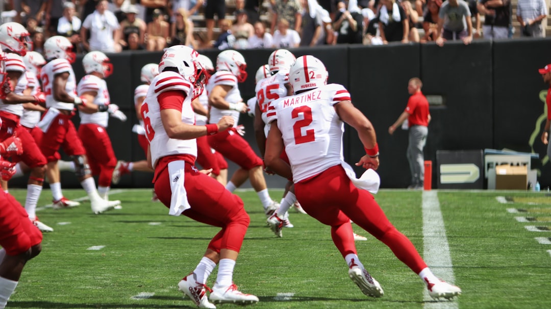 football players in red and white jersey shirt