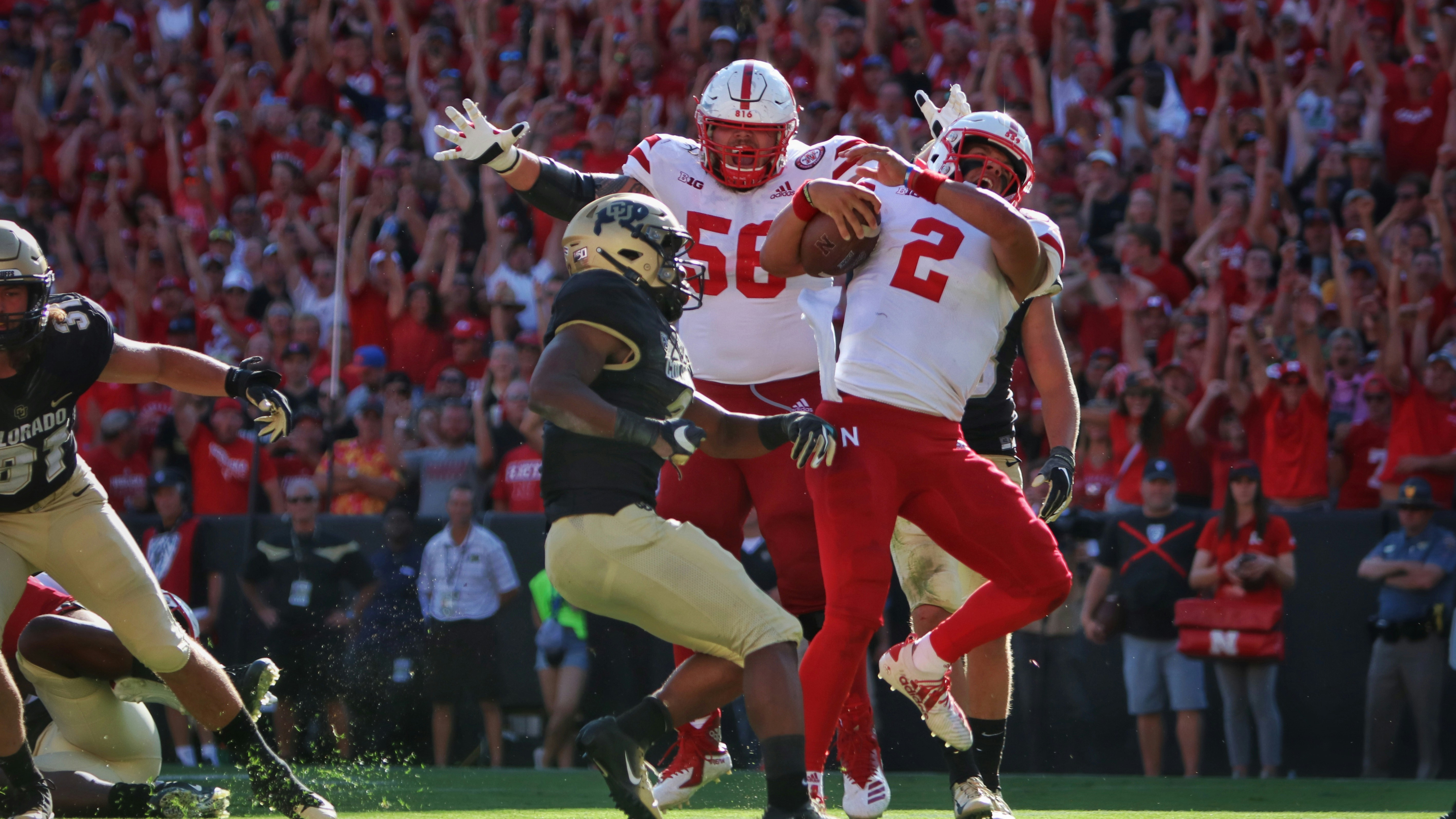 football players in red and white jersey shirt
