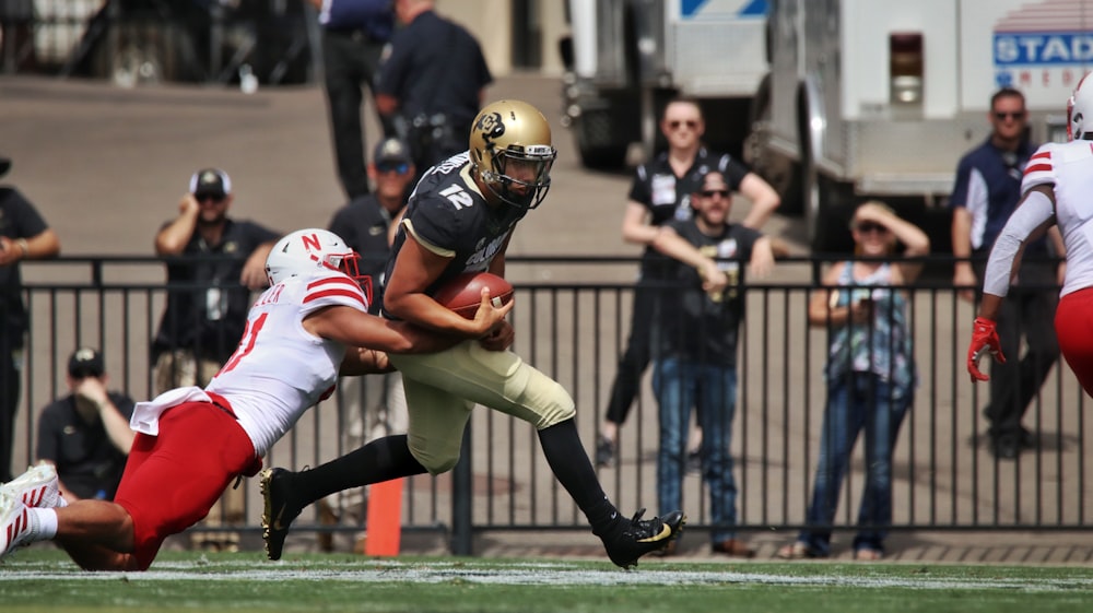 football players on field during daytime