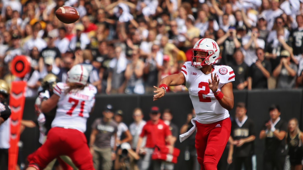 football players in red and white jersey shirt