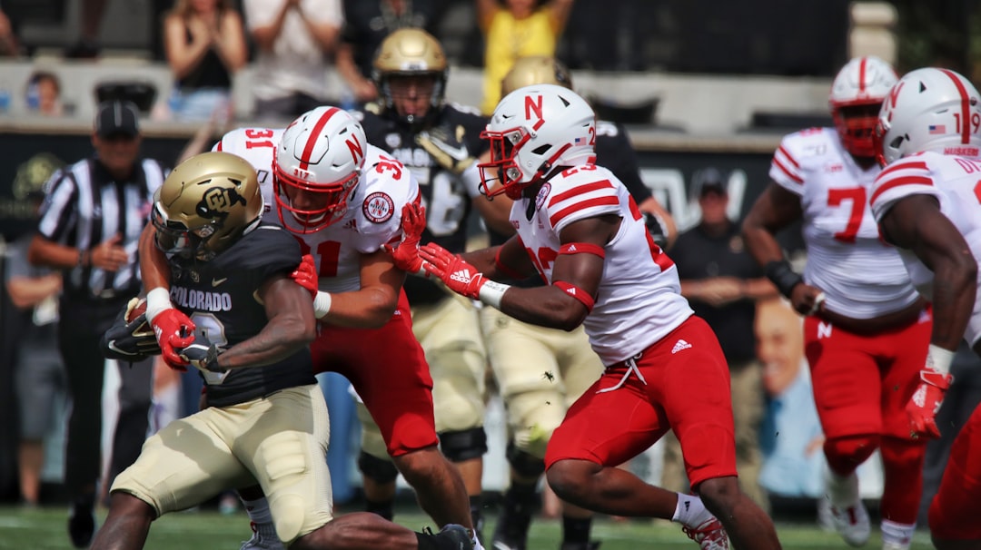 football players in red and white jersey shirt