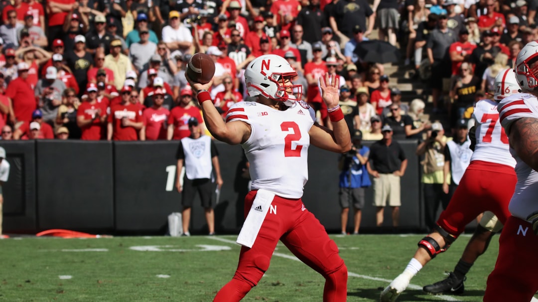 football players in red and white jersey shirt