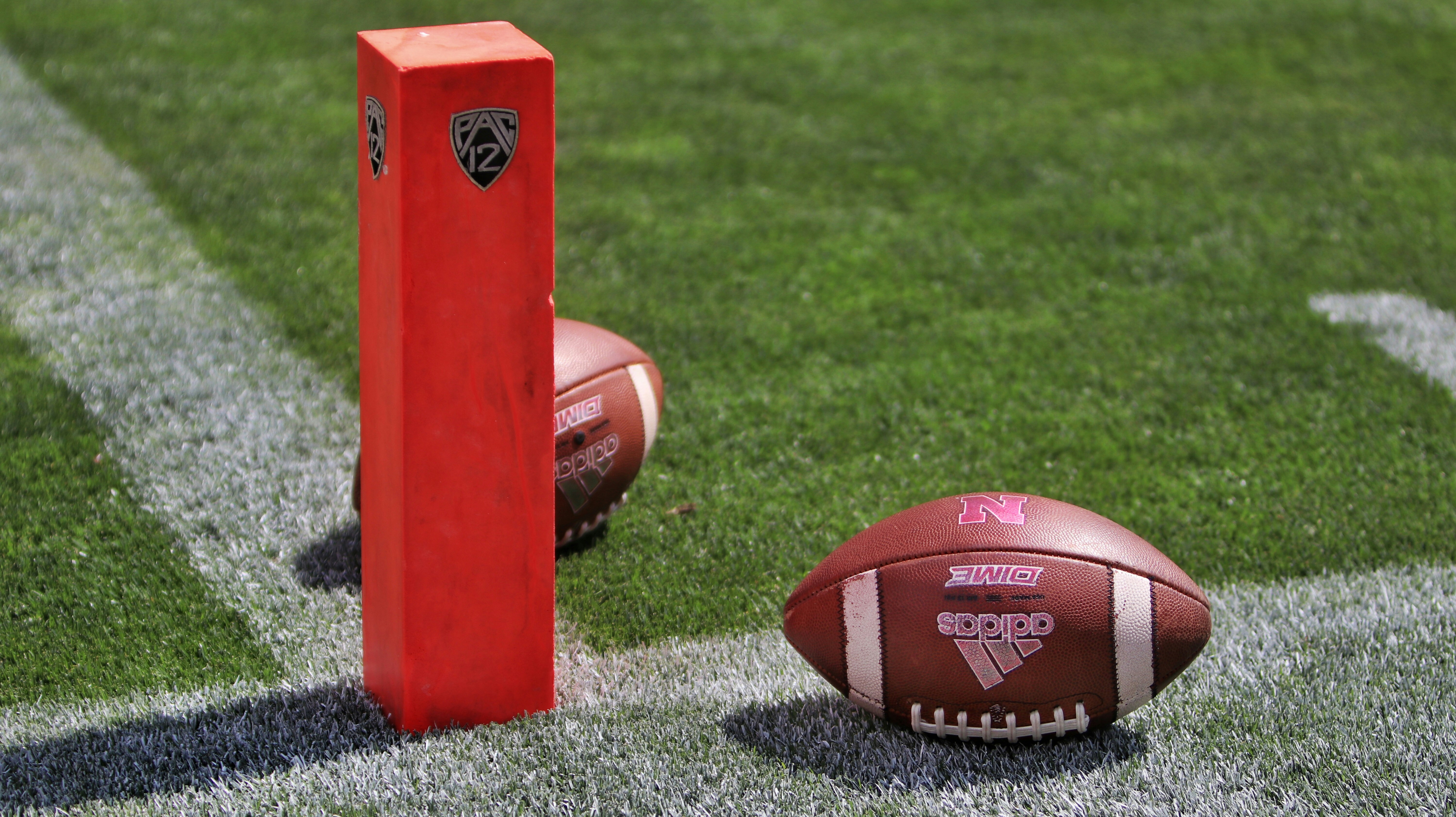 brown football on red box