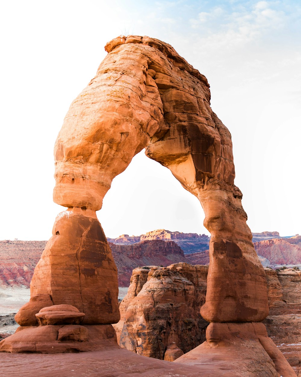 brown rock formation under white sky during daytime