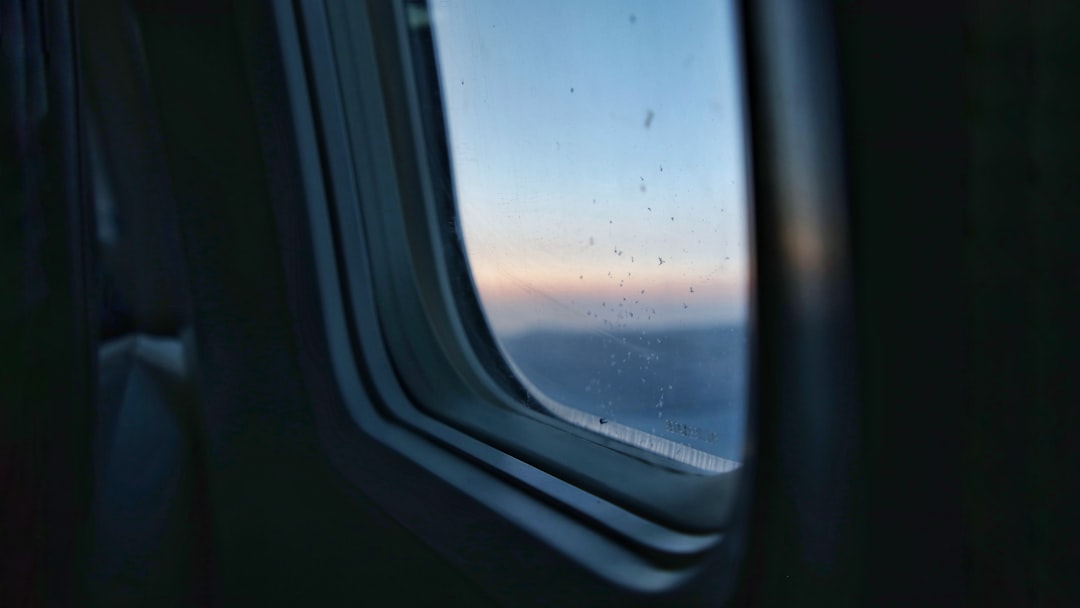 airplane window view of white clouds during daytime