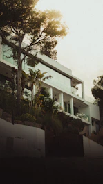 Elegant exterior of a contemporary home surrounded by lush greenery