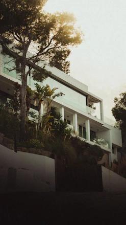 A bright, freshly cleaned modern home exterior glowing under sunlight.