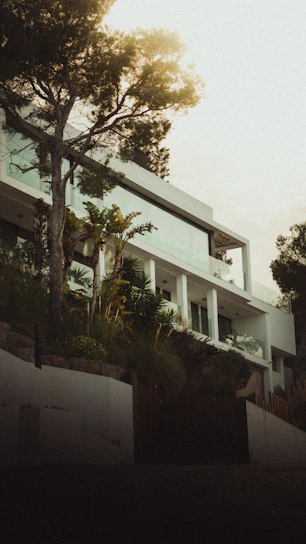 A sleek modern home exterior bathed in warm natural light showcasing clean lines and harmonious design.