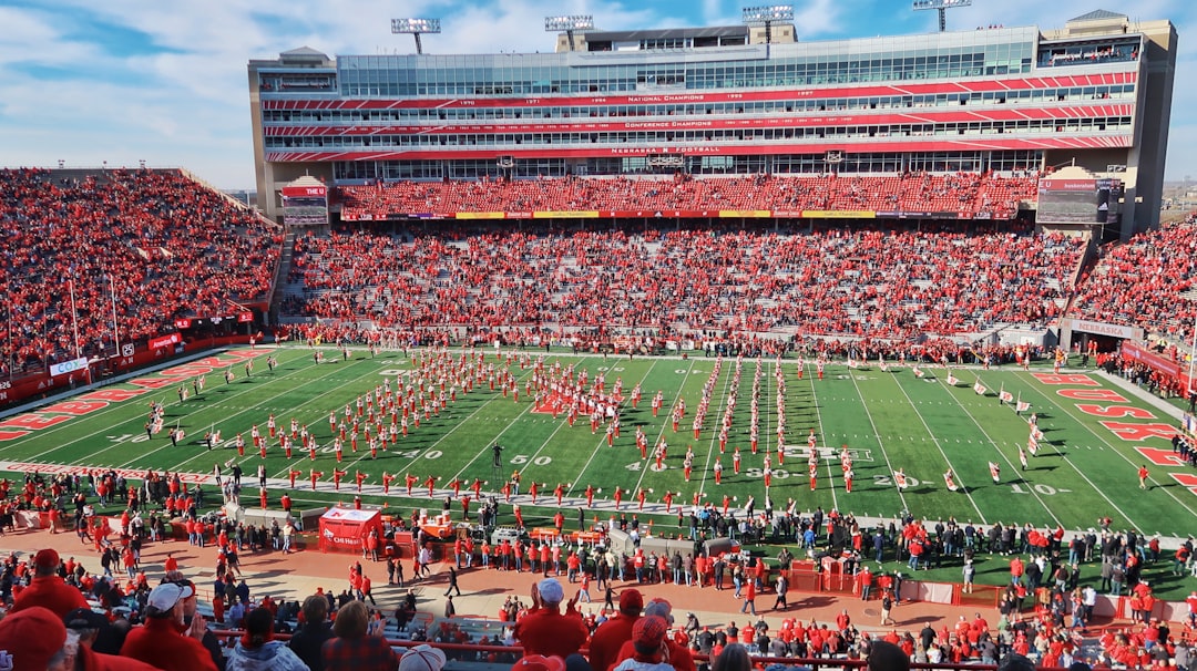 people on football stadium during daytime