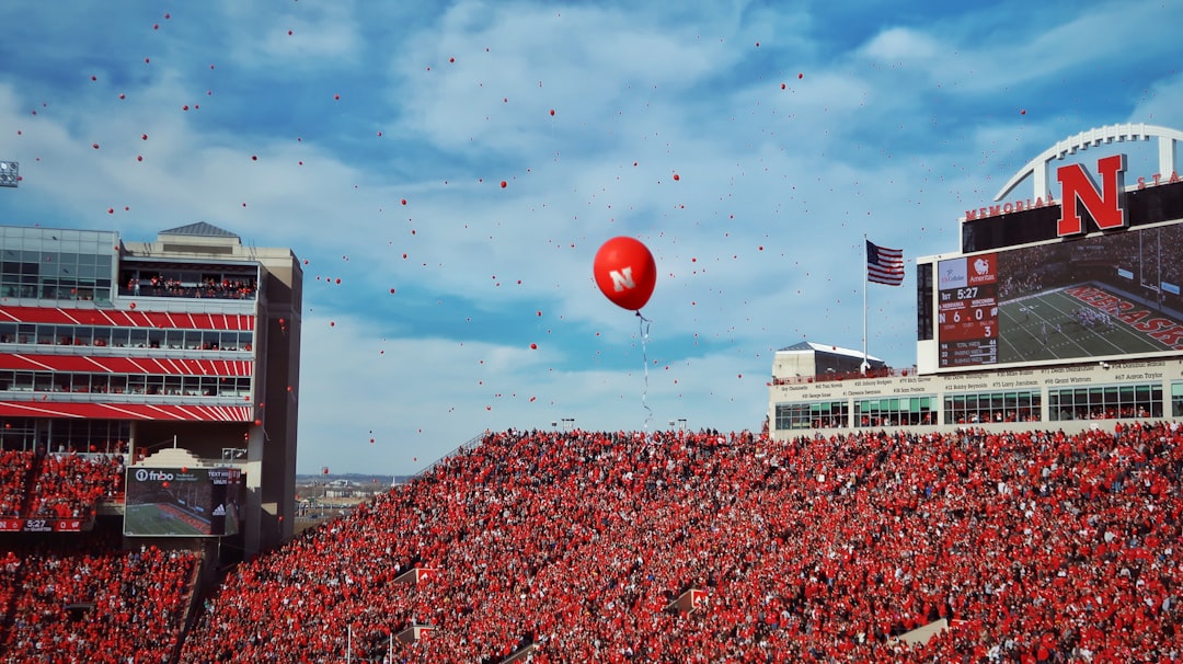red balloon floating on the sky during daytime
